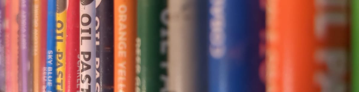 A row of oil pastels in various colours. 